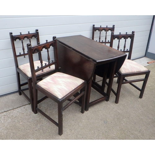 651 - A dark Ercol drop leaf table together with four chairs (5)