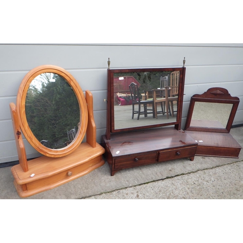 659 - A mahogany toilet mirror together with a pine swing mirror and a mirror with brush box (3)