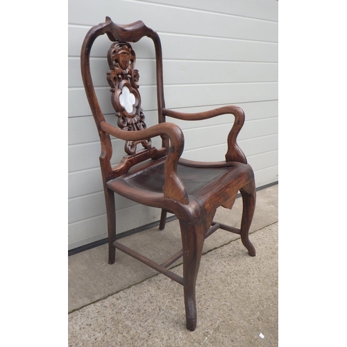 660 - An Eastern hardwood open armchair with marble inset splat, repair