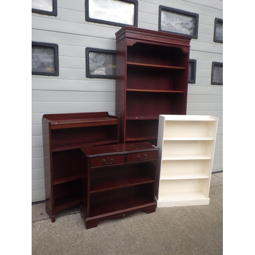 669 - A reproduction mahogany low bookcase, two further mahogany bookcases and a white painted bookcase (4... 