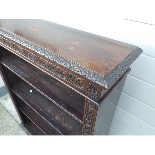 671 - A Victorian carved oak open low bookcase, 93cm wide