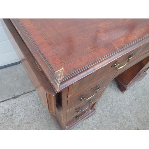 678 - A mahogany & satinwood banded kneehole desk with side drop leaves, drawer stamped Edwards & Roberts ... 