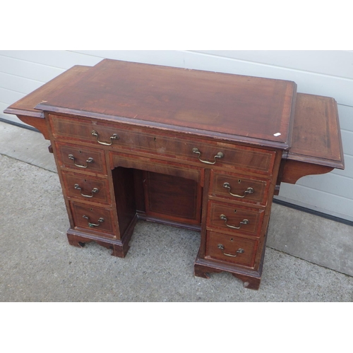 678 - A mahogany & satinwood banded kneehole desk with side drop leaves, drawer stamped Edwards & Roberts ... 