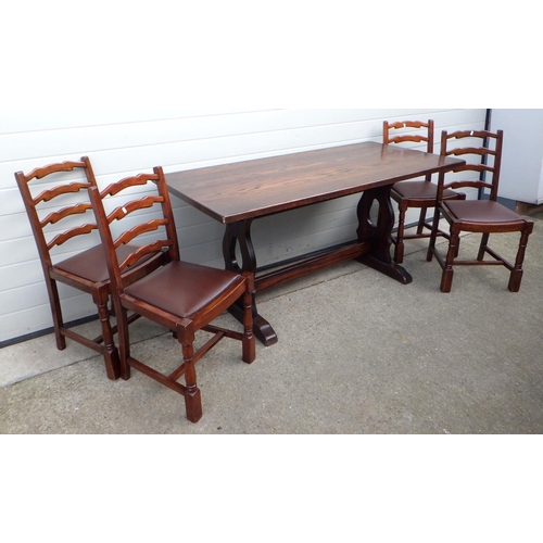 711 - An oak refectory table, 160cm long with four ladderback chairs (5)