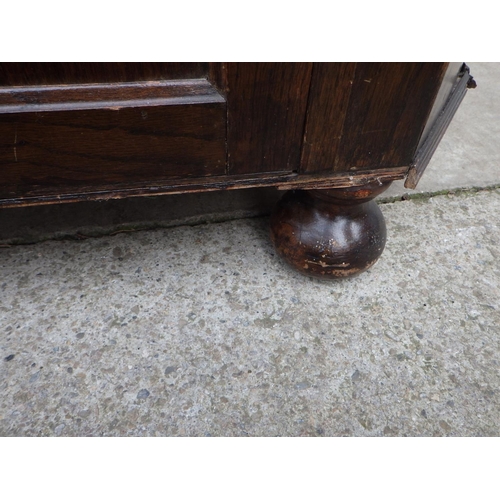 722 - A 1930's oak hall wardrobe, missing some moulding a/f