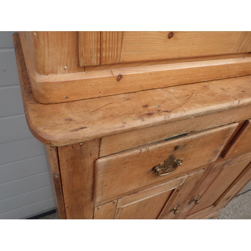 734 - A pine cupboard together with a matched cabinet top, 103cm wide, 207cm tall