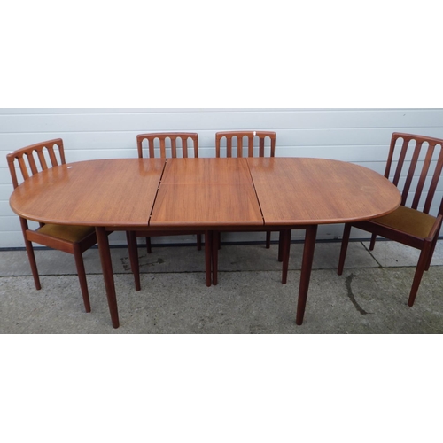 739 - A teak dining table with six chair frames