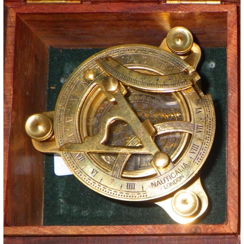 132 - A reproduction maritime interest compass together with further brass ware to include door knockers, ... 