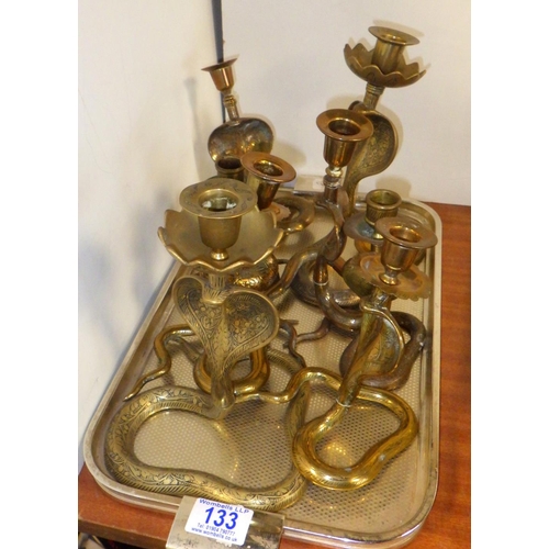 133 - Four pairs of brass cobra candlesticks 132832