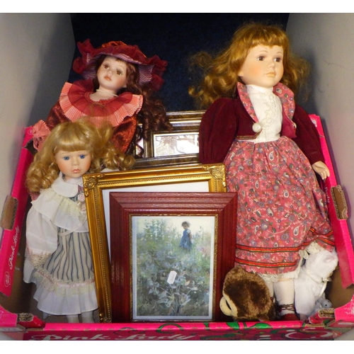 173 - A group of three porcelain faced dolls together with fairy pictures