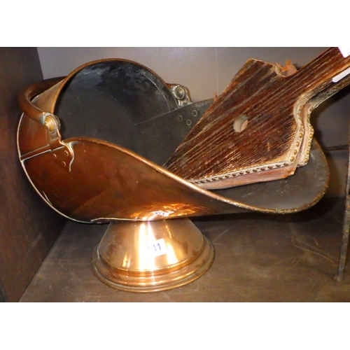 211 - A large 19thC copper coal scuttle, together with a trivet and bellows