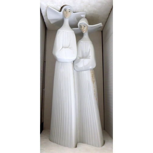 228 - A large boxed Lladro figure of two nuns