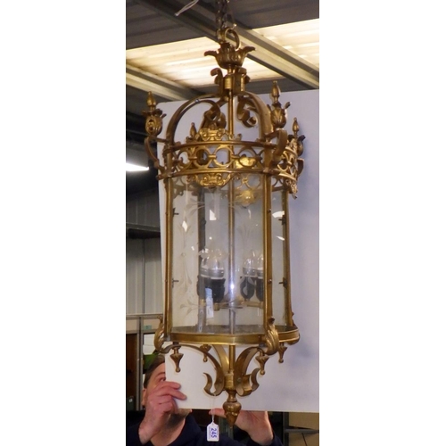 245 - A large brass hanging lantern, missing two glass panels approx 100cm drop