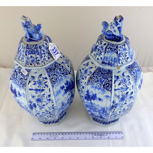 337 - A pair of 19thC octagonal blue and white ribbed Delft lidded urns signed J . V 38 CM tall, AF some c... 