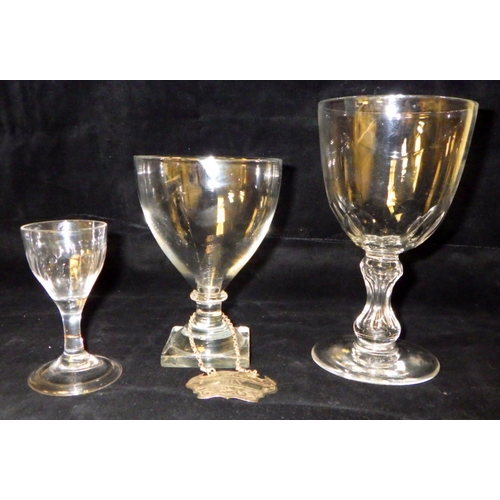 400 - A 19th C glass rummer together with two further stemmed glasses and a silver Gin bottle label