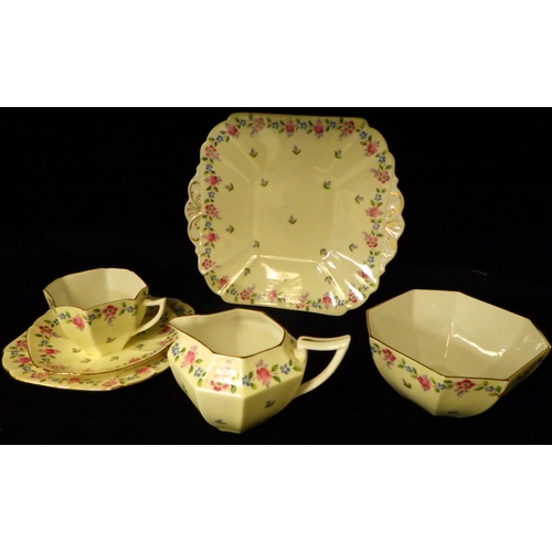 403 - A part Shelley (Queen Anne shape) floral tea set to include 11 trio's, two serving plates, sugar bow... 