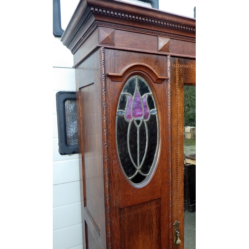 630 - An Edwardian oak single wardrobe, with leaded glass panels, 110cm wide