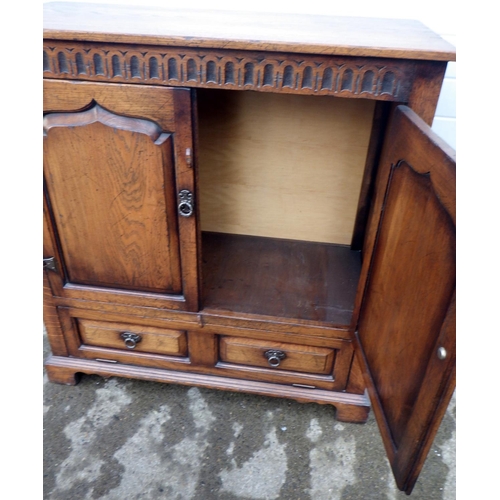 631 - A panelled oak television cabinet, later back, 100cm wide