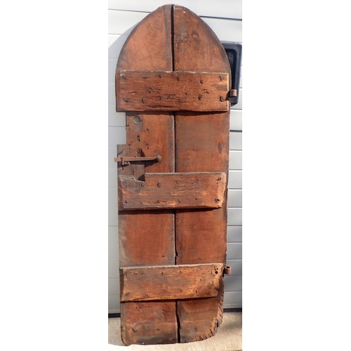 725 - A lancet topped oak two plank tower door with ironwork, 64cm x 191cm (ex York Minster Stores)