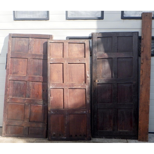 734 - Three panelled oak doors together with a blind fretwork  strip of wood, largest approx 183cm x 79cm ... 