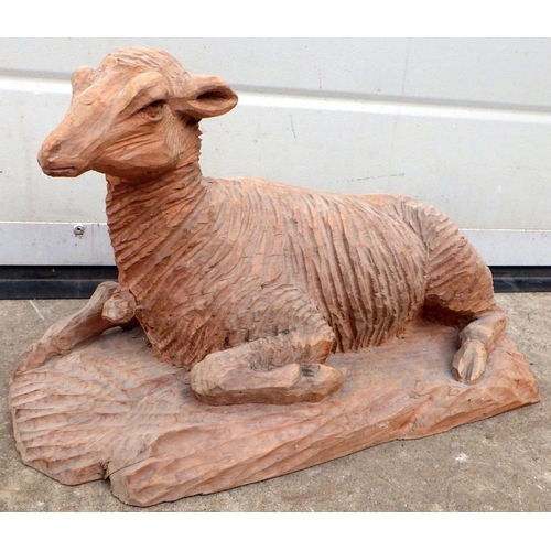 751 - A carved wooden figure of a sheep 31cm long (ex York Minster Stores)