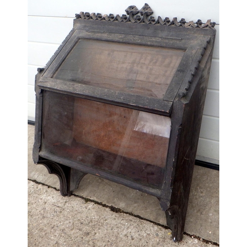 758 - A wall mounted carved oak display case, some damage, 56cm wide (ex York Minster Stores)