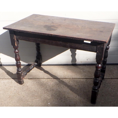 771 - A dark stained rectangular oak table on turned legs, 100cm wide (ex York Minster Stores)