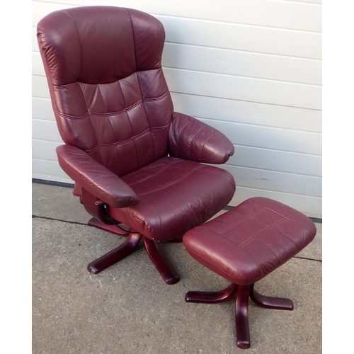 799 - A red leather swivel easy chair & stool