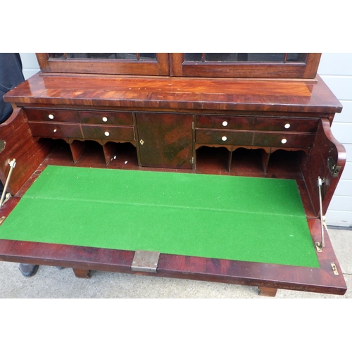 816 - A mahogany secretaire bookcase, with label Smiths Antiques, The Rink, a/f, 115cm wide 237cm tall