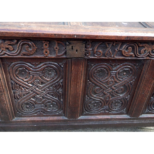 817 - An 18th cen four panel oak coffer, later carving , 138cm wide