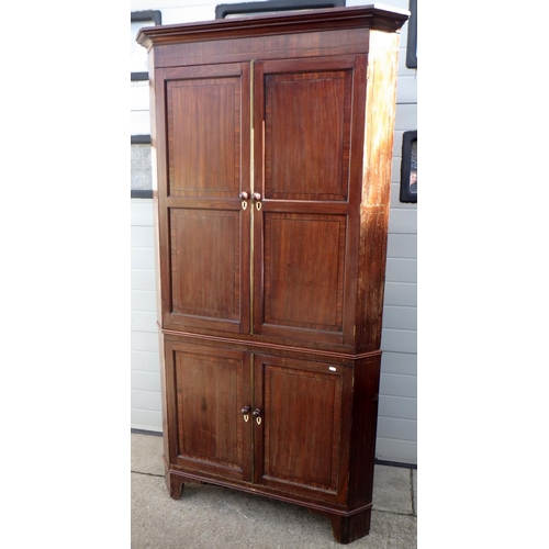 821 - A 19th cen tall mahogany two section corner cupboard, later handles,