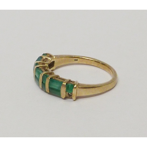 10 - A 9ct gold emerald dress ring.  A/F one stone lacking, chips and abrasions to stones.  Approximately... 