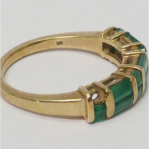 10 - A 9ct gold emerald dress ring.  A/F one stone lacking, chips and abrasions to stones.  Approximately... 