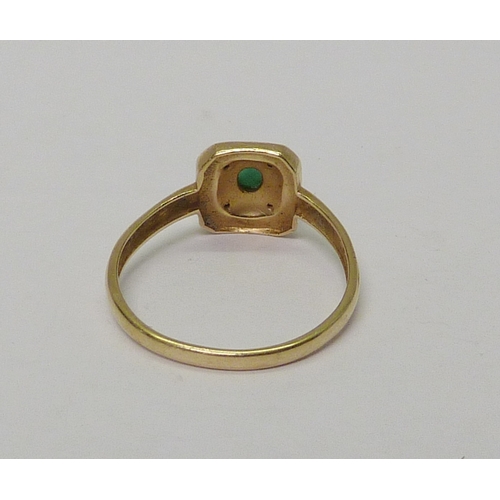 15 - A dress ring, 14ct gold set with emerald and diamond in a green enamel halo.  Late 20th cent.  Appro... 