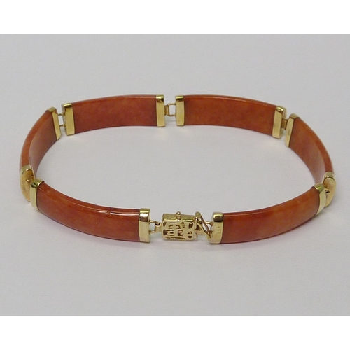 2 - A panel bracelet, yellow metal marked 14k / 585 and brown jade. 180mm long  
736811