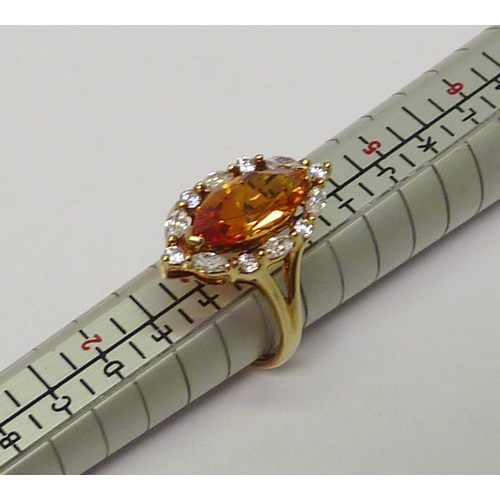 20 - A 14ct gold marquise cut synthetic yellow sapphire & clear gemstone dress ring.  Approximately 3.5gr... 