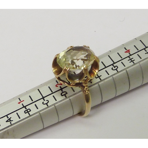 26 - A 9ct gold and oval cut citrine cocktail ring.  Approximately 3gr gross / size J 1/2.  
 809190