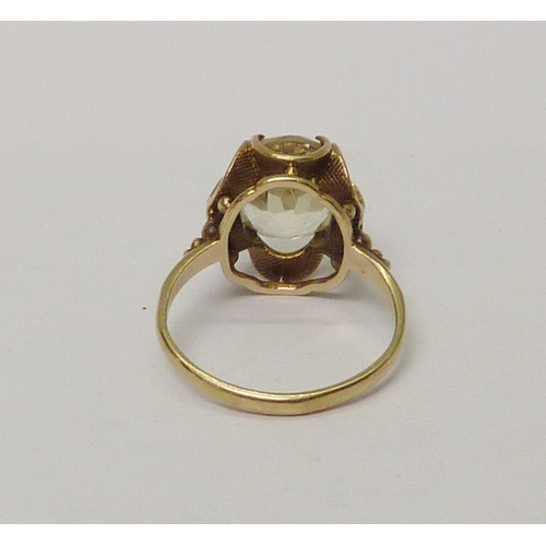 26 - A 9ct gold and oval cut citrine cocktail ring.  Approximately 3gr gross / size J 1/2.  
 809190