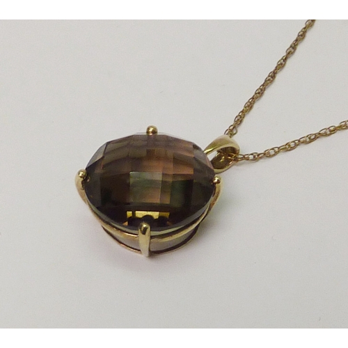 28 - A 9ct gold smoky quartz pendant suspended from a 9ct gold neck chain. Approximately 8.5gr gross/ 28m... 