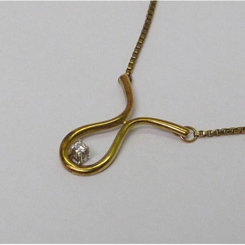 29 - A openwork pendant necklace, yellow metal marked 9k set with a single diamond.  Pendant drop 23mm.  ... 