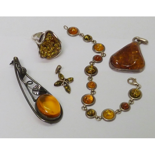 35 - Amber and white metal jewellery incl a ring and pendant; other white metal jewellery set with a Labr... 