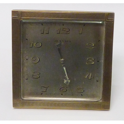 An Ateliers Juvenia desk clock having a silvered dial in a