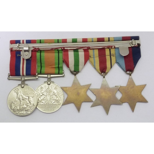 52 - A WW2 group of five medals comprising 1939-45 Star, Africa Star, Italy Star, Defence Medal, and War ... 