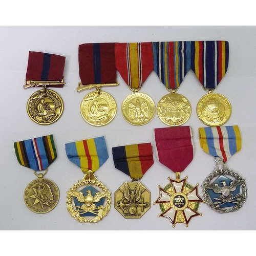 55 - A collection of US Marine Corps interest medals including Legion of Merit, Defense Distinguished Ser... 