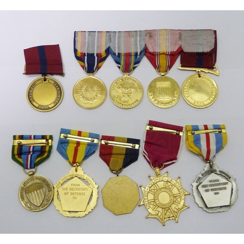 55 - A collection of US Marine Corps interest medals including Legion of Merit, Defense Distinguished Ser... 