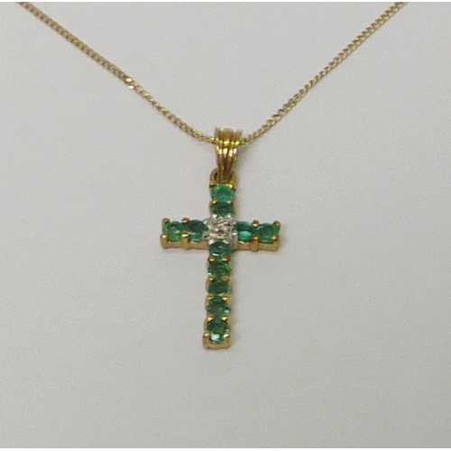 7 - A cross pendant, 9ct gold set with diamond & emerald, the whole suspended from an unmarked yellow me... 