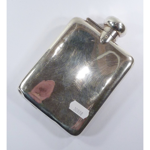 12 - A silver hip flask, London 1935.  150 x 100mm  / 210gr gross.  A/F bruised
30888