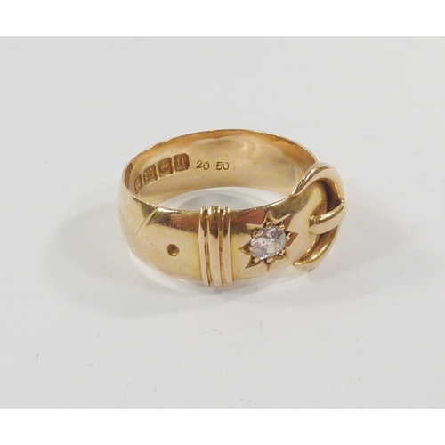 23 - A buckle ring, 18ct gold set with a single old cut diamond, a/f chip to table.  Diamond approx 3.75m... 