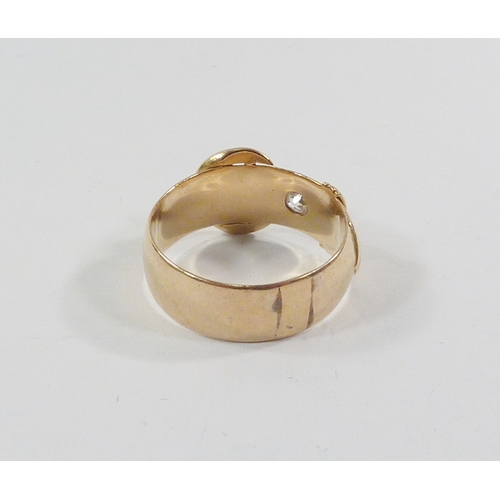 23 - A buckle ring, 18ct gold set with a single old cut diamond, a/f chip to table.  Diamond approx 3.75m... 