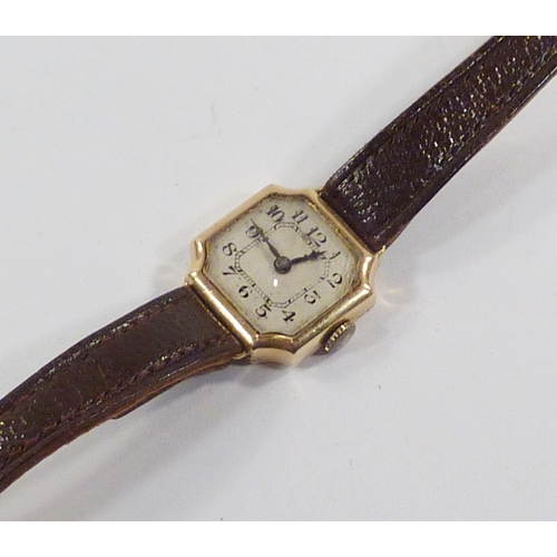 28 - A ladies' square wristwatch comprising a manual wind movement in a 9ct gold case.  18mm across head.